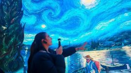 A Mexican influencer explores a metaverse experience pod. (Photo by Qu Chang)